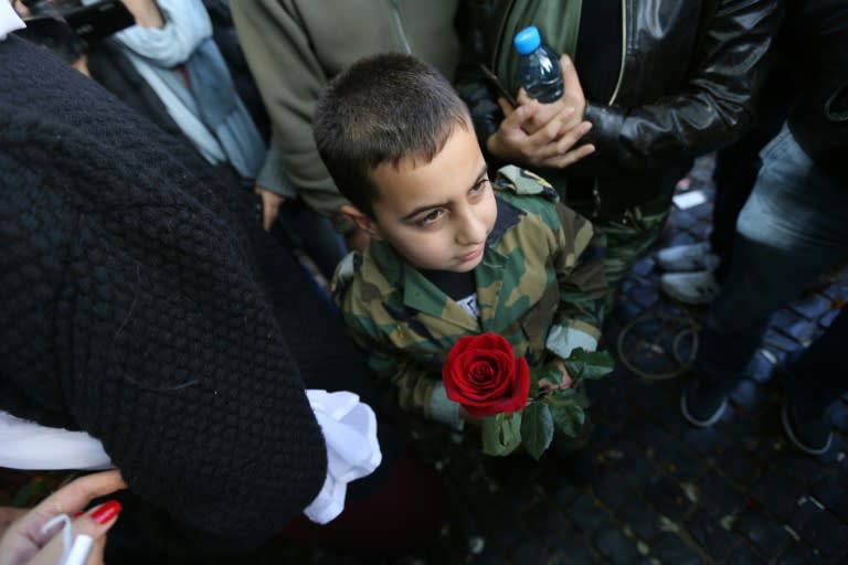 A young boy awaits a relative in downtown Beirut as Lebanese soldiers and policemen kidnapped by jihadist groups from the eastern border town of Arsal are released, on December 1, 2015