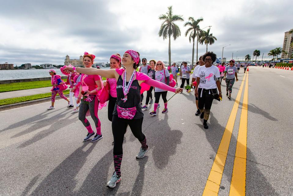 Tara Council, Virginia Beach, (center) walks with her cousins, Kelly Stephens, Asheville, (left) and Rachel Paul, Coral Springs, at the 2020 Komen South Florida Race for the Cure in West Palm Beach, Saturday, Jan. 25, 2020. [ALLEN EYESTONE/palmbeachpost.com]