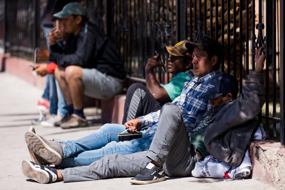 Venezuelan migrants are staying in front and across the street of Sacred Heart Church, on Wednesday, April 26, 2023, after crossing into the U.S.