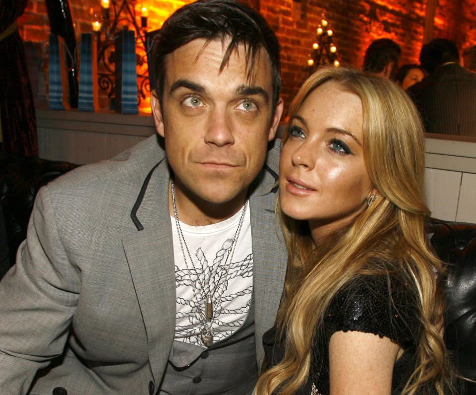 Robbie Williams and Lindsay Lohan (Photo by Chris Polk/FilmMagic)
