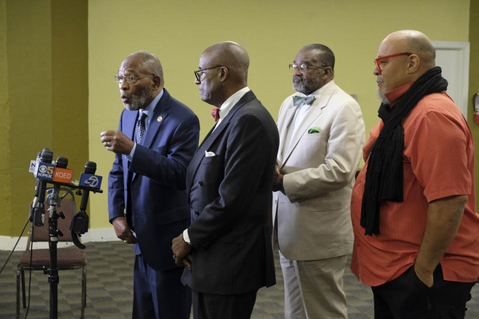 African American leaders from left, local NAACP President Dr. Amos Brown, columnist Noah Griffin, Rev. Arnold Townsend and artist Dewey Crumbler voice their support for keeping a controversial mural at Washington High School during a news conference Tuesday, Aug. 6, 2019, in San Francisco. The controversial 13-panel, 1,600-square foot mural, the "Life of Washington," criticized as racist and degrading for its depiction of black and Native American people, is slated to be destroyed after the San Francisco School Board voted last month to paint over it. (AP Photo/Eric Risberg)