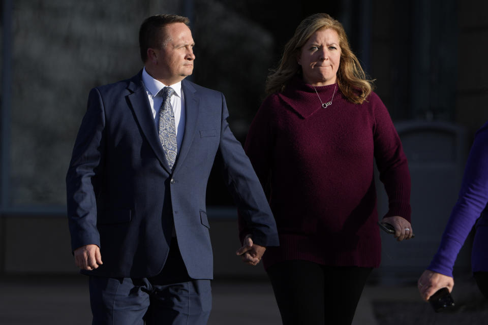 Paramedic Jeremy Cooper, left, enters the Adams County, Colo., Justice Center, Friday, Dec. 22, 2023, in Brighton, Colo. A Colorado prosecutor says the two paramedics failed to properly care for Elijah McClain when they overdosed the Black man with a sedative that he didn’t need. McClain, a 23-year-old massage therapist, died after being stopped and forcibly restrained by police officers and then injected with ketamine in 2019 in the Denver suburb of Aurora. (AP Photo/David Zalubowski)