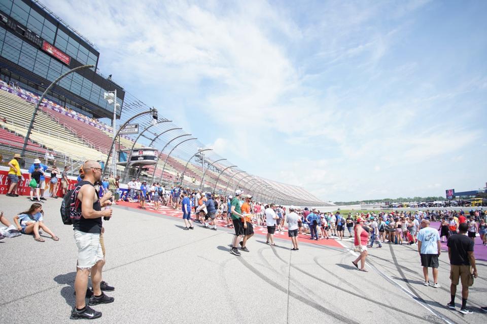 Fans get their spots near the finish line for driver introductions prior to Sunday's Firekeepers Casino 400 at Michigan International Speedway.