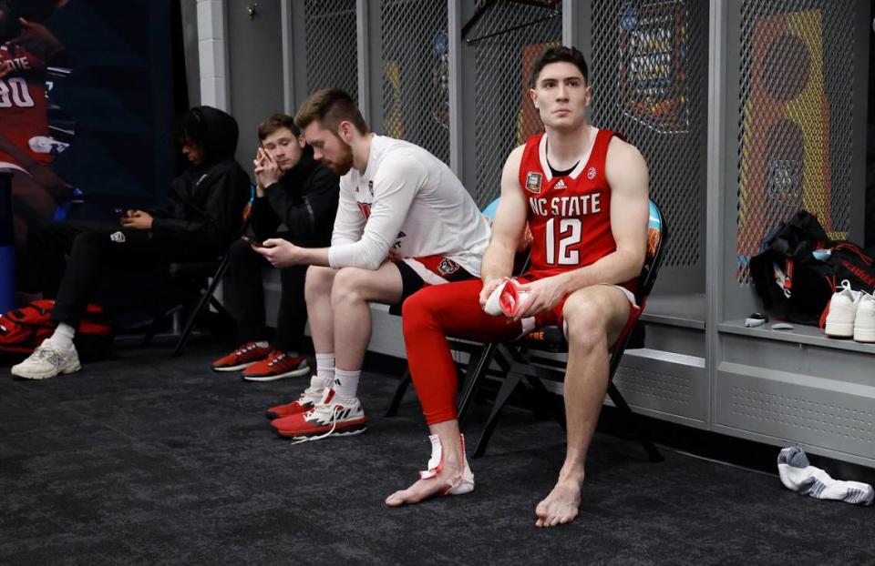 N.C. State’s Michael O’Connell (12) sits in the locker room after Purdue’s 63-50 victory over N.C. State in the NCAA Tournament national semifinals at State Farm Stadium in Glendale, Ariz., Saturday, April 6, 2024.