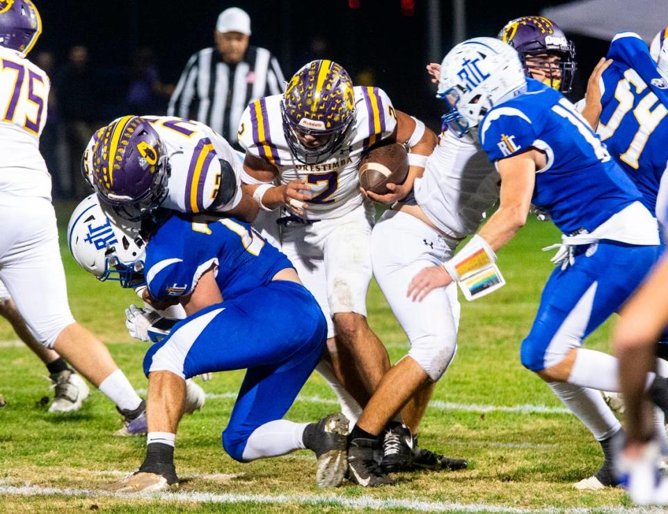 Orestimba’s Juan Esquivez (2) works his way through the line towards a first down in the Sac-Joaquin Section Division VII-A Championship against Ripon Christian at Ripon Christian High School on Friday, Nov. 17, 2023.