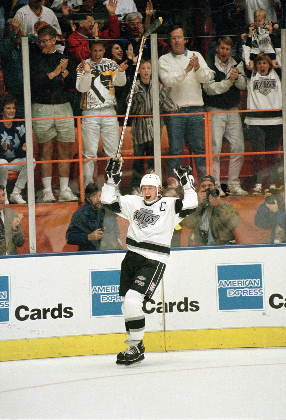 FILE - Wayne Gretzky and fans celebrate after he scored his NHL career record-setting 802nd goal against the Vancouver Canucks at the Forum in Inglewood, Calif., in this March 23, 1994, file photo. Alex Ovechkin starts a new five-year contract ready to chase Wayne Gretzky's career goals record that long seemed unbreakable. The Washington Capitals captain has 730 goals and needs 165 to pass Gretzky. (AP Photo/Eric Draper, File)