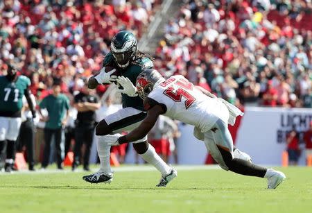 Sep 16, 2018; Tampa, FL, USA; Philadelphia Eagles running back Jay Ajayi (26) runs with the ball as Tampa Bay Buccaneers linebacker Lavonte David (54) tackles during the second half at Raymond James Stadium. Mandatory Credit: Kim Klement-USA TODAY Sports