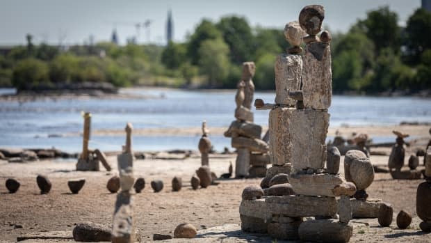 Balancing rock sculptures at Remic Rapids Park along the Ottawa River in Ottawa. (Brian Morris/CBC - image credit)