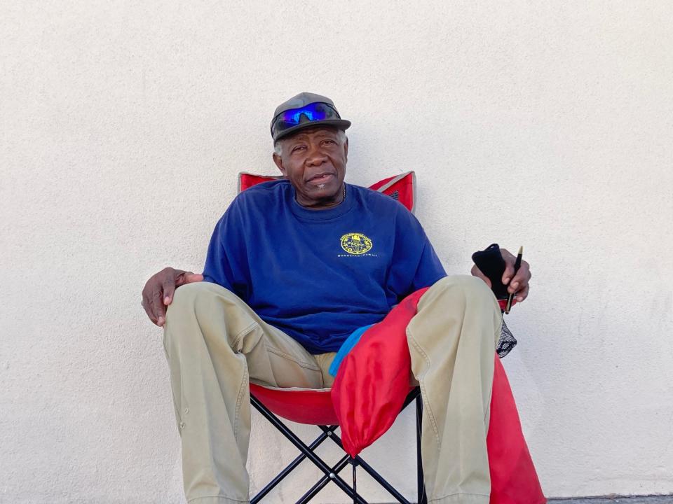 Frank Spencer, 74, watches Brightline train go by in Fort Pierce morning of Sept. 22, 2023.