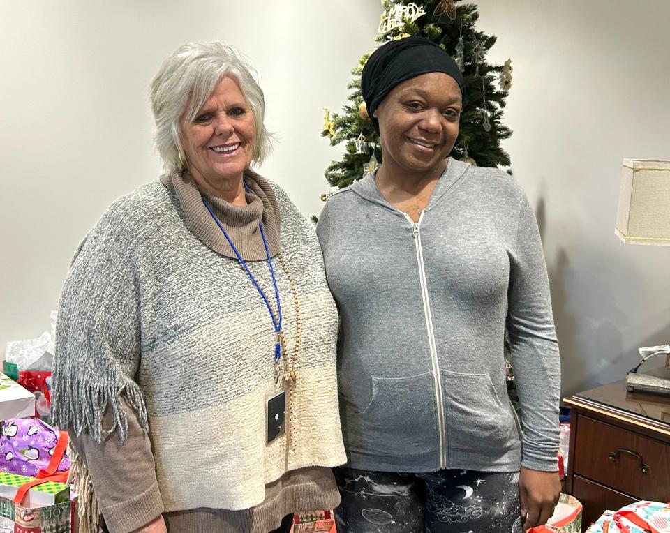 Dream Center Executive Director Gail Gustafson (left) poses for a pictures with resident Krystle Terry on December 12, 2023 in Jackson, Tenn.