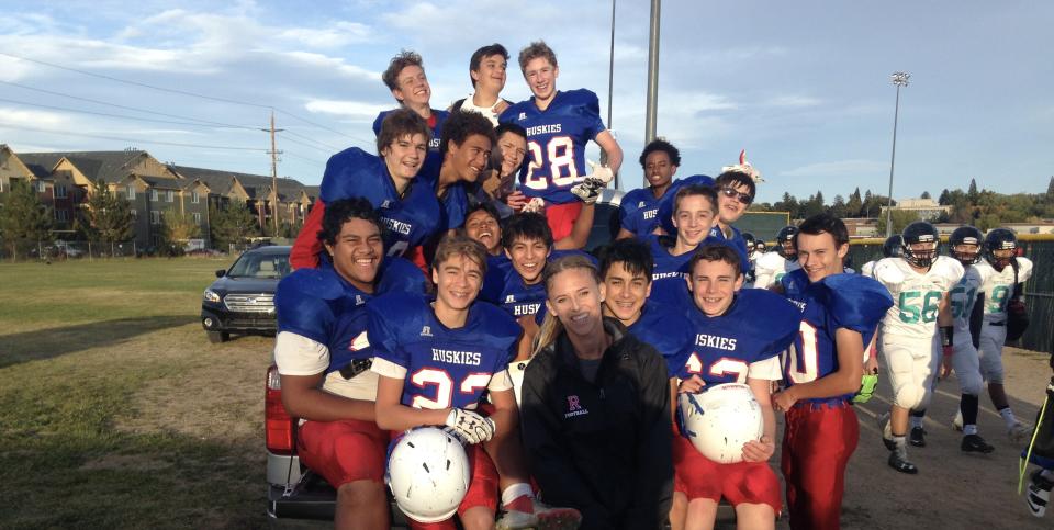 Kaitlan Reiff poses with the freshman defensive backs she coached at Reno High School (via Kaitlan Reiff)