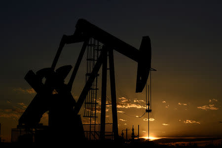 FILE PHOTO: A pump jack on a lease owned by Parsley Energy operates at sunset in the Permian Basin near Midland, Texas U.S. August 23, 2018. Picture taken August 23, 2018. REUTERS/Nick Oxford/File Photo