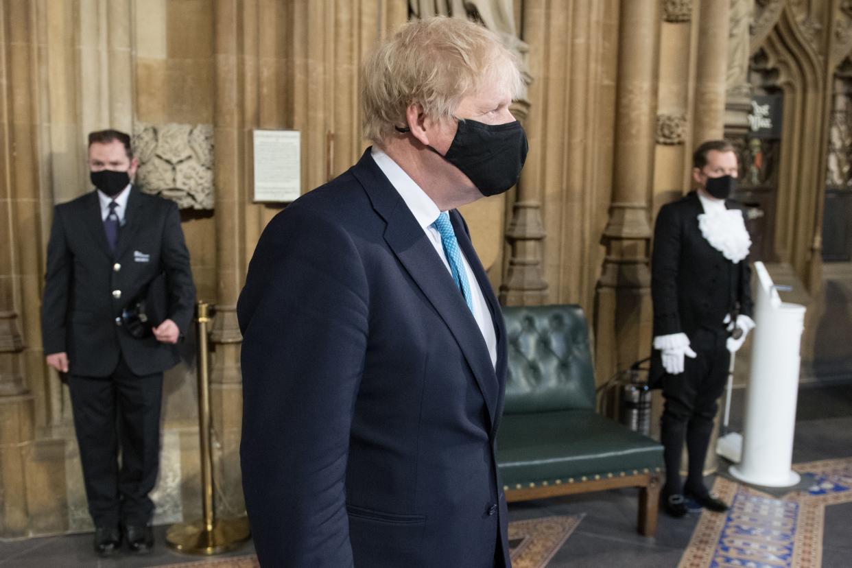 <p>Boris Johnson processes through the Central Lobby with other party leaders on their way from the House of Lords after listening to the Queen's Speech during the state opening of parliament</p> (PA)