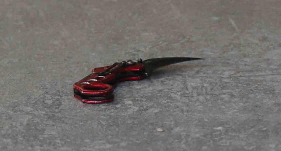 A knife is seen at the scene where fugitive Jonathan Dick has been arrested near Flinders Street, in Melbourne's CBD.