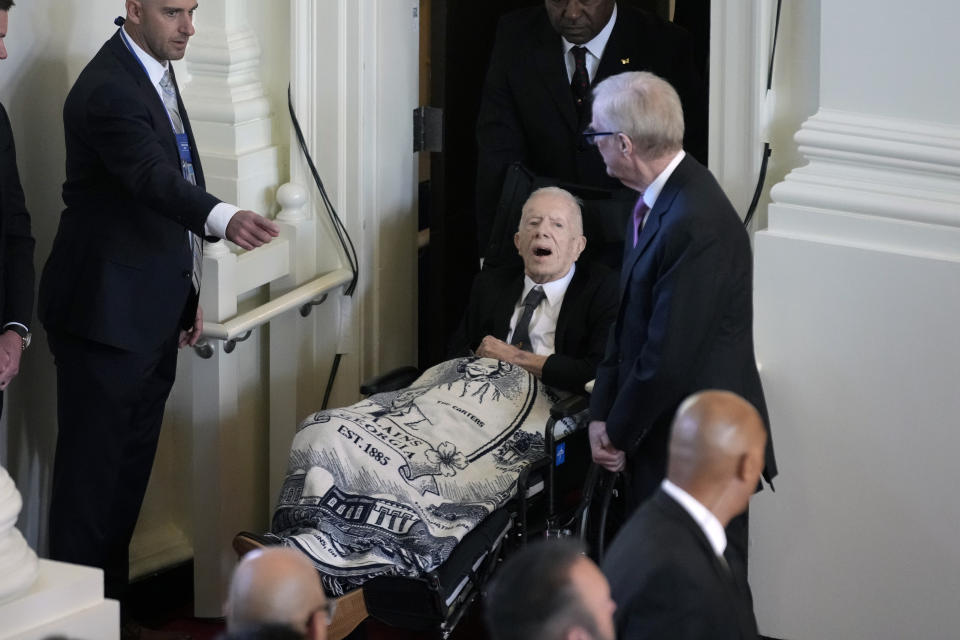 Former President Jimmy Carter arrives to attend a tribute service for his wife and former first lady Rosalynn Carter, at Glenn Memorial Church, in Atlanta, Tuesday, Nov. 28, 2023. It was Jimmy Carter's first public appearance since he entered hospice care, other than a brief ride with Rosalynn in September's Plains Peanut Festival parade. (AP Photo/Andrew Harnik)