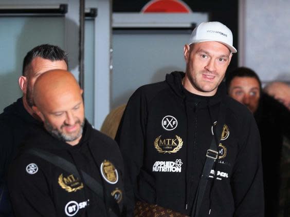 Tyson Fury arriving back at Manchester Airport (PA)