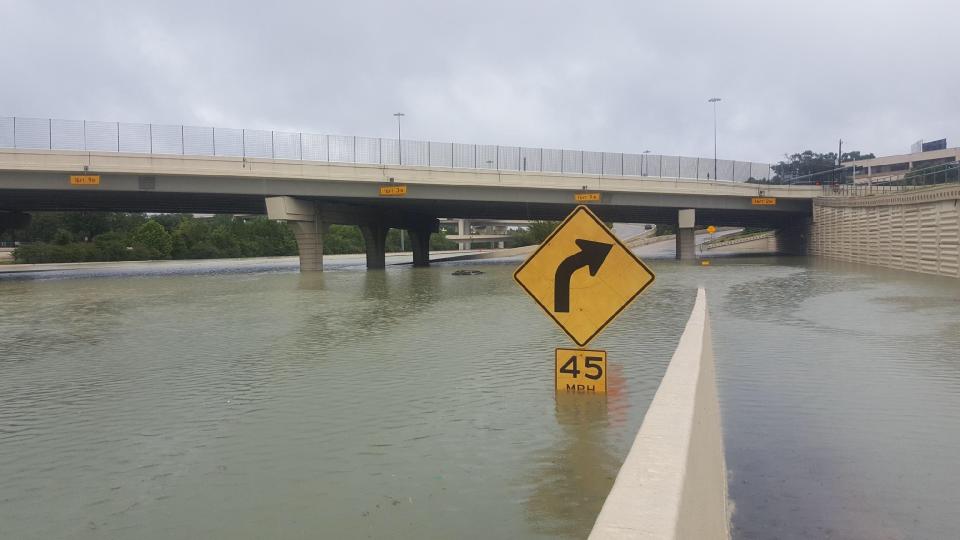 A partially submerged speed limit sign in Katy, Texas, shows how high the floodwaters have reached in some areas. (Photo: David Lohr/HuffPost)