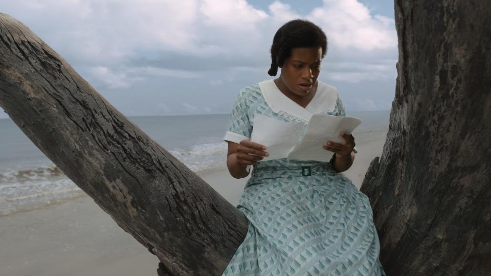 Celie (Fantasia Barrino) reads a letter from her sister in movie musical "The Color Purple."