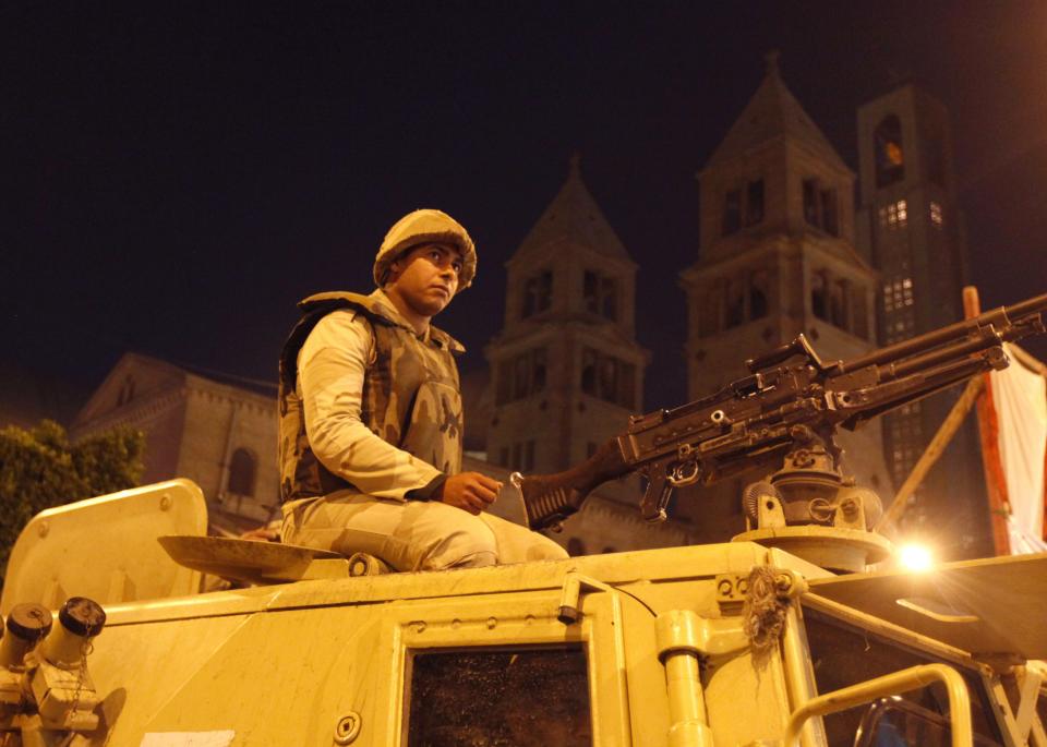 Army soldiers guard the streets during a Coptic Christmas eve mass at the main cathedral in Cairo
