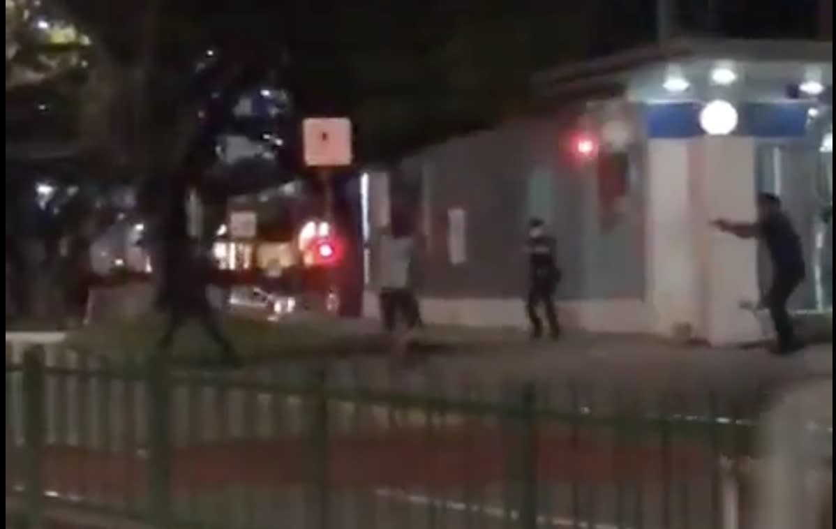 A video posted on Instagram shows a knife-wielding man (in white shirt) confronting police officers at Clementi Police Division. He was later shot in the arm after he charged at an officer.