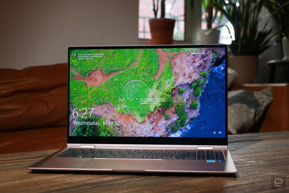 Samsung Galaxy Book Pro 360 review pictures. Front view of the 15-inch Galaxy Book Pro 360 on a table in front of a brown couch.