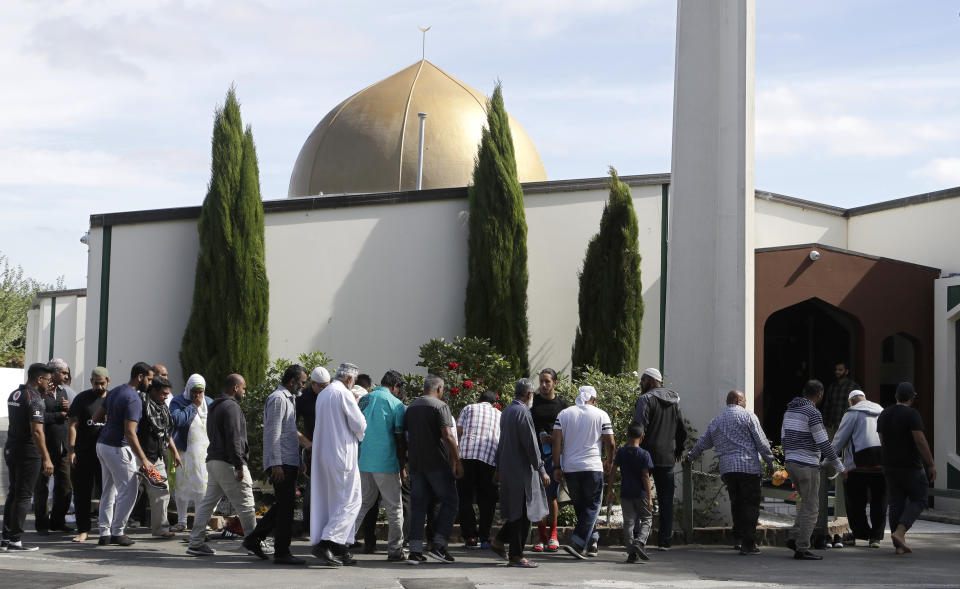 FILE - In this Saturday, March 23, 2019 file photo, Worshippers prepare to enter the Al Noor mosque following last week's mass shooting in Christchurch, New Zealand. The death toll from the Christchurch mosque attacks has risen to 51 after a Turkish man who had been hospitalized since a gunman opened fire on worshippers seven weeks ago died overnight, authorities in New Zealand and Turkey confirmed, Friday, May 3, 2019. (AP Photo/Mark Baker, File)