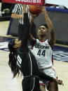 Connecticut forward Aubrey Griffin (44) drives to the basket against Providence forward Mary Baskerville (10) in the second half of an NCAA college basketball game at Harry A. Gampel Pavilion, Saturday, Jan. 9, 2021, in Storrs, Conn. (David Butler II/Pool Photo via AP)