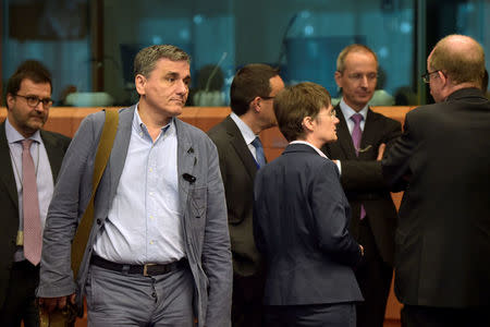 Greece's finance Minister Euclid Tsakalotos arrives at a Euro zone finance ministers meeting to discuss whether Greece has passed sufficient reforms to unblock new loans and how international lenders might grant Athens debt relief, in Brussels, Belgium May 24, 2016. REUTERS/Eric Vidal