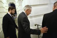 U.S. Senate Majority Leader Harry Reid (D-NV) (C) departs with an aide and his security detail after talks with the Republican-controlled U.S. House of Representatives reached a final impasse during a late-night session at the U.S. Capitol in Washington, October 1, 2013. The U.S. government fell into a major shutdown over Republican efforts to halt President Barack Obama's healthcare reforms using a temporary spending bill as last minute maneuvers failed to resolve deep differences between Democrats and Republicans. REUTERS/Jonathan Ernst (UNITED STATES - Tags: POLITICS BUSINESS)