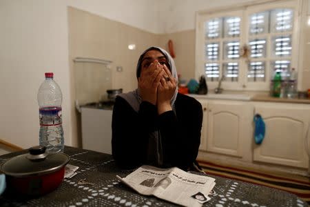 Olfa, 39, mother of Rahma who is the wife of Nurdine Chouchan, who was killed during a U.S. air strike in Libya, reacts during an interview with Reuters in Tunis, Tunisia April 14, 2016. Picture taken April 14, 2016. REUTERS/Zohra Bensemra