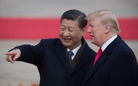 Xi Jinping and Donald Trump - Credit: NICOLAS ASFOURI/AFP