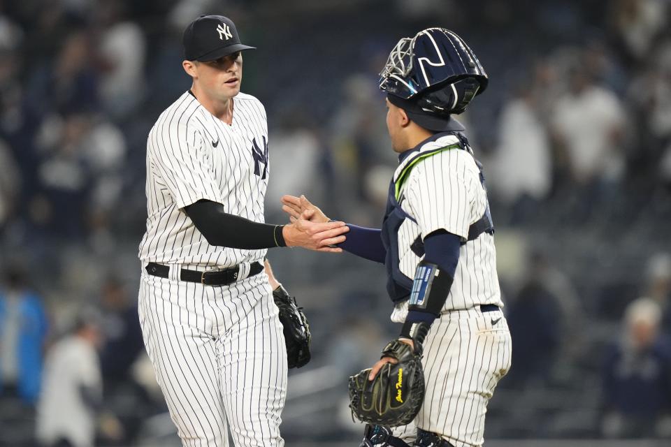 New York Yankees relief pitcher Clay Holmes, left, celebrates with catcher Jose Trevino, right, after the second baseball game of a doubleheader against the Chicago White Sox, Thursday, June 8, 2023, in New York. (AP Photo/Frank Franklin II)