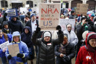 <p>Marilyn Schleyer, of Belleview, Ky., holds a sign as demonstrators gather during the March for Our Lives protest for gun legislation and school safety outside city hall in Cincinnati, Ohio. (Photo: AP/John Minchillo) </p>