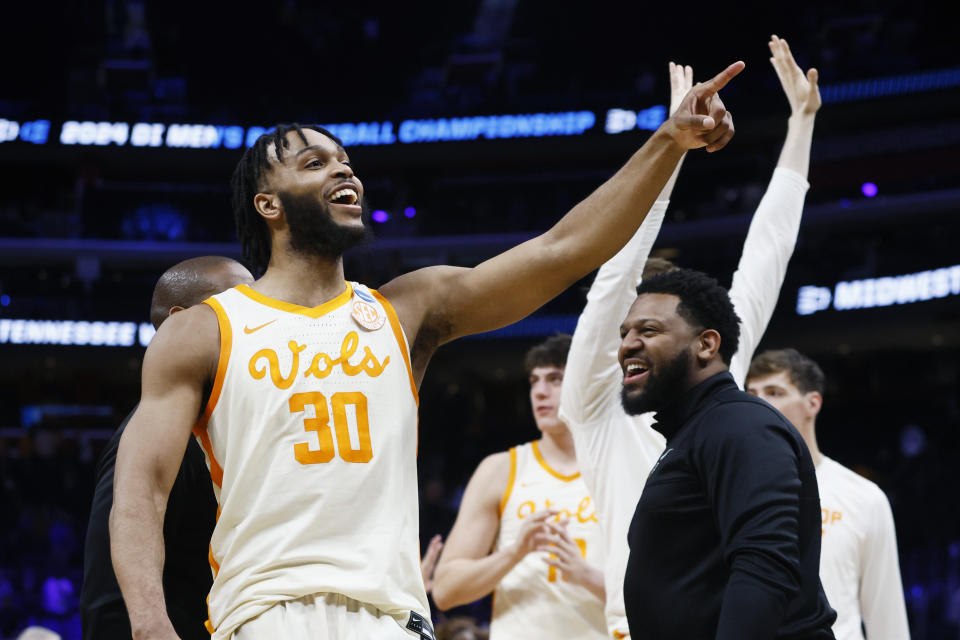 Tennessee guard Josiah-Jordan James (30) and teammates celebrate their 82-75 win over Creighton in a Sweet 16 college basketball game in the NCAA Tournament, Friday, March 29, 2024, in Detroit. (AP Photo/Duane Burleson)