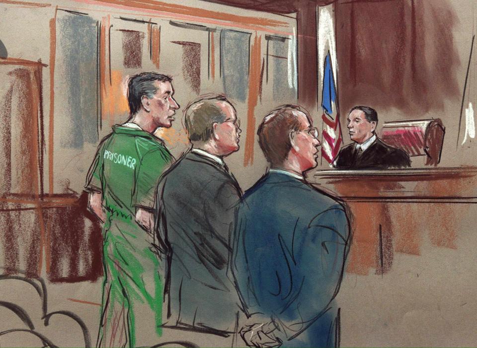 This 31 May 2001 photograph of an artist's drawing shows alleged US spy Robert Hanssen, left, his attorney Plato Cacheris (second from left), federal prosecutor Randy Bellows (second from right) and US District Judge Claude Hilton (right) inside U.S. District Court in Alexndria, Virginia, on May, 31, 2001, during Hanssen's arraignment on spying charges.