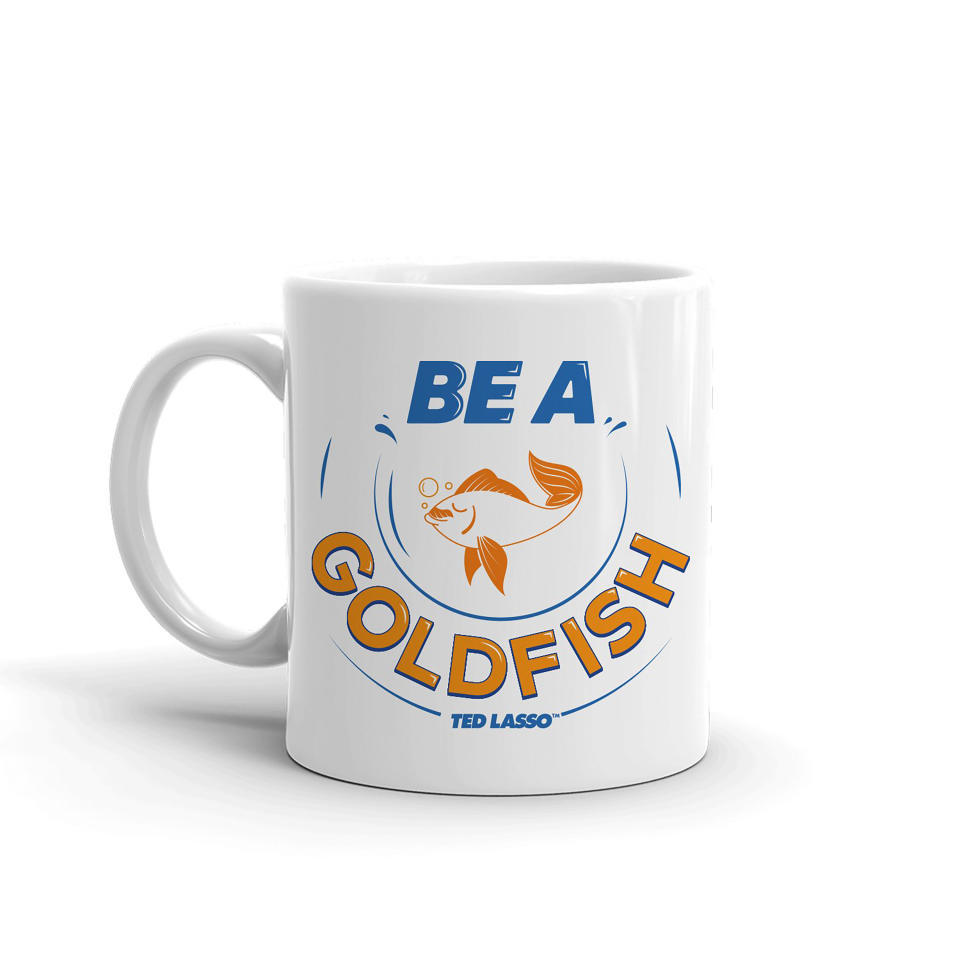 This image released by Warner Bros. Consumer Products shows A "Tad Lasso" mug with one of the popular character's favorite sayings. Warner Bros. has an online shop full of gift options for super fans of the series. (Warner Bros. Consumer Products via AP).