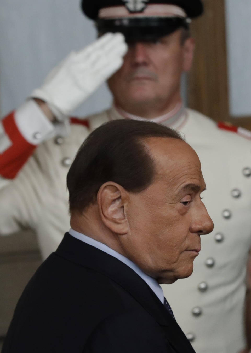 Forza Italia party leader Silvio Berlusconi leaves after meeting Italian President Sergio Mattarella, in Rome, Thursday, Aug. 22, 2019. President Sergio Mattarella continued receiving political leaders Thursday, to explore if a solid majority with staying power exists in Parliament for a new government that could win the required confidence vote. (AP Photo/Alessandra Tarantino)