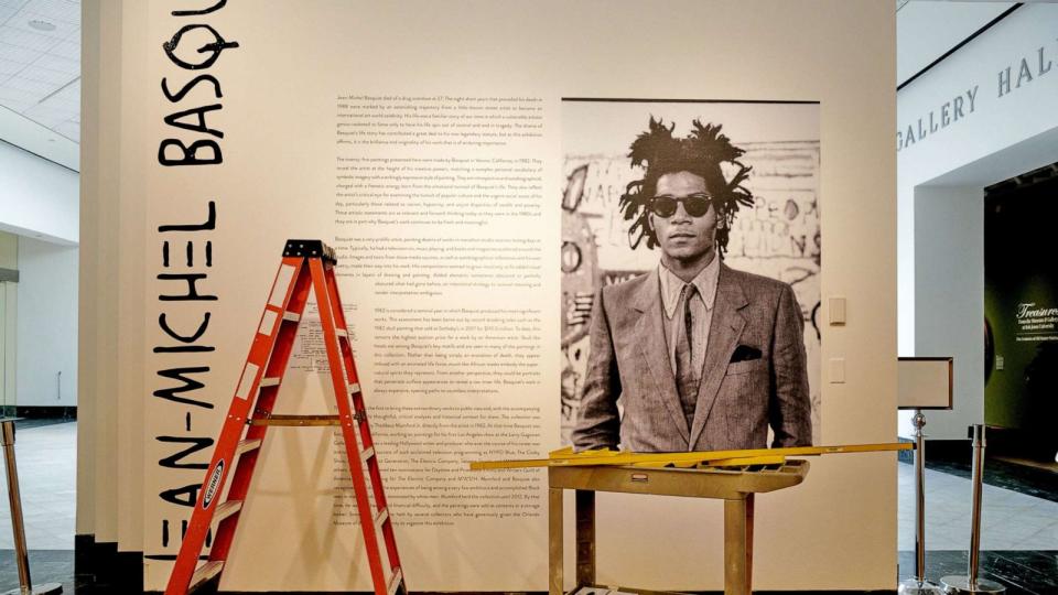 PHOTO: In this Feb. 2, 2022, file photo, the sign for the exhibit 'Heroes & Monsters: Jean-Michel Basquiat' is shown at the Orlando Museum of Art, in Orlando, Fla. (Melanie Metz/The New York Times/Redux, FILE)