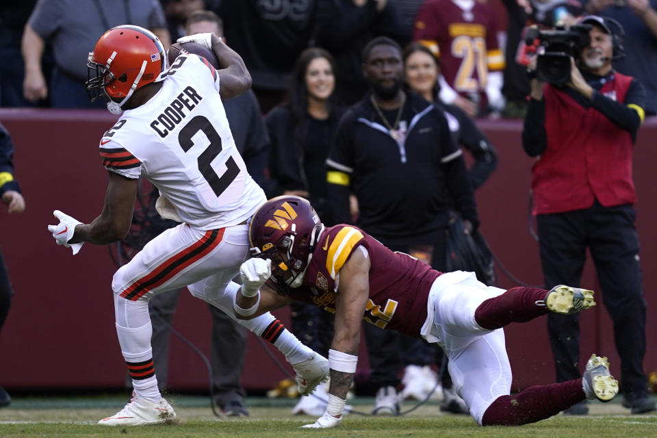 Cleveland Browns wide receiver Amari Cooper (2) gets past Washington Commanders safety Darrick Forrest (22) to score a touchdown during the second half of an NFL football game, Sunday, Jan. 1, 2023, in Landover, Md. (AP Photo/Patrick Semansky)