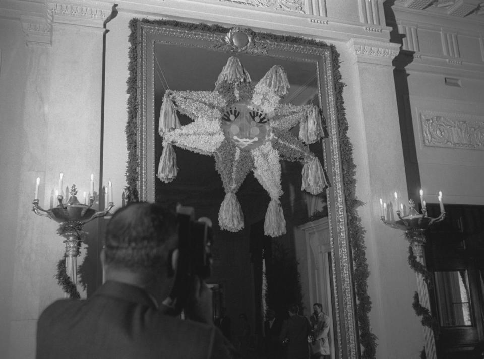 A pinata hangs in the White House for Christmas in 1964.