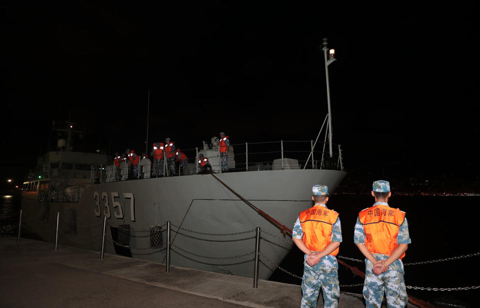 A ship from China's People's Liberation Army (PLA) Navy arrives at a naval base on Stonecutters Island in Hong Kong.