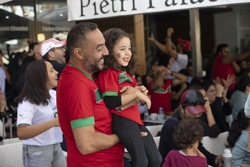 Morocco soccer fans react while watching their national team beat Beglium 2-0 at a World Cup soccer match played in Qatar, in Rabat, Morocco, Sunday, Nov. 27, 2022. (AP Photo)