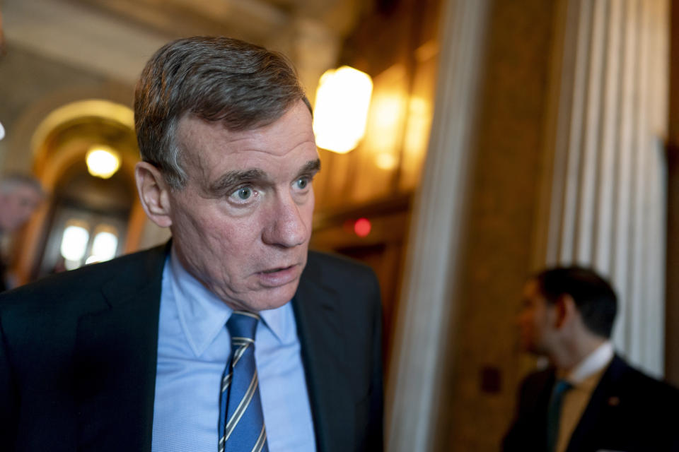 FILE - Senate Intelligence Committee Chairman Mark Warner, D-Va., speaks to a reporter at the Capitol in Washington, March 16, 2022. “The United States faces a dramatically different threat landscape today than it did just a couple of decades ago,” said Warner, “New threats and new technology mean that we have to make substantial adjustments to our counterintelligence posture if we are going to protect our country’s national and economic security.” (AP Photo/J. Scott Applewhite, File)