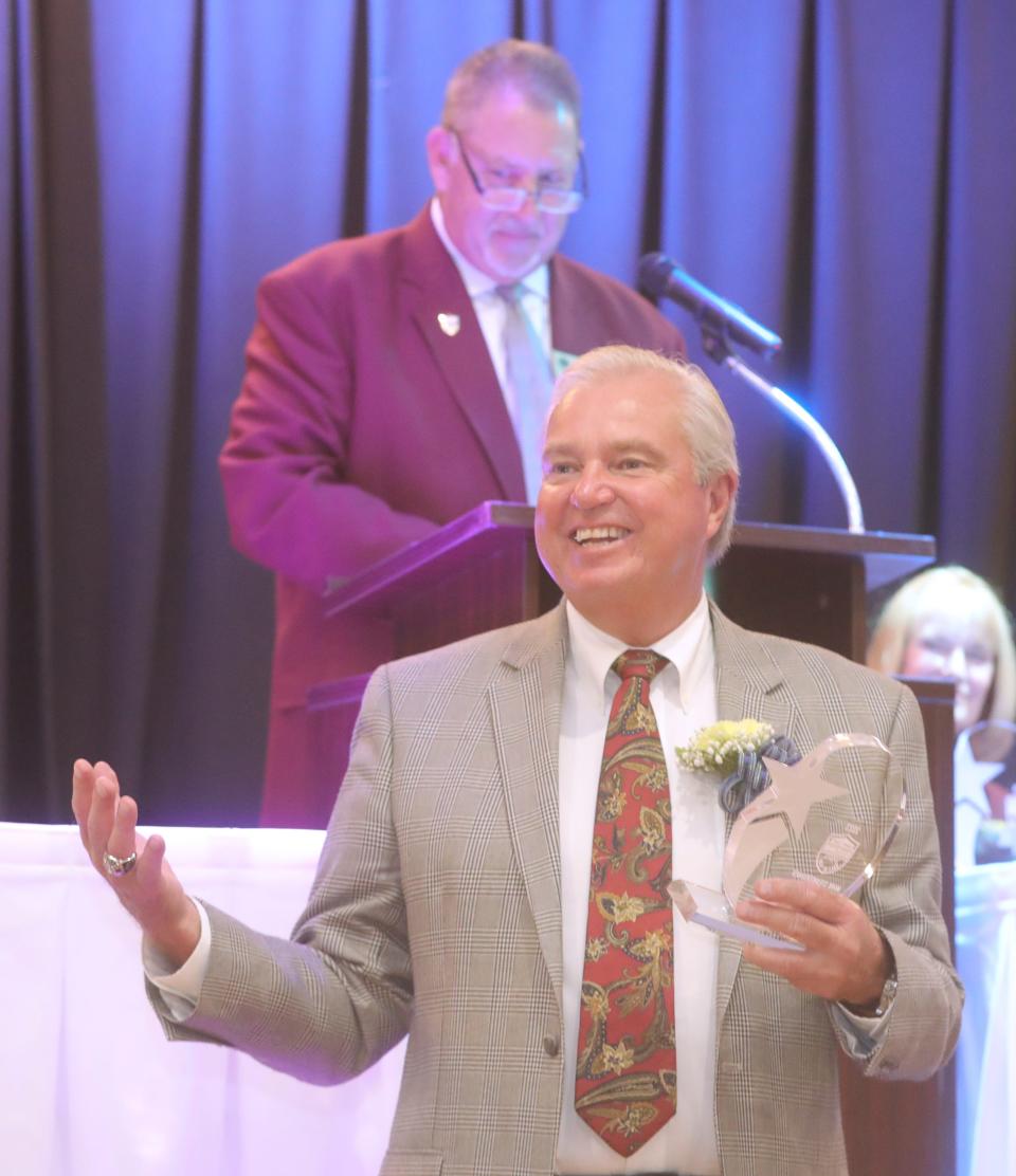 Summit County Sports Hall of Fame inductee Mark Steinkerchner tells a story about his NFL officiating days during the awards banquet Tuesday at Annunciation Greek Orthodox Church in Akron.