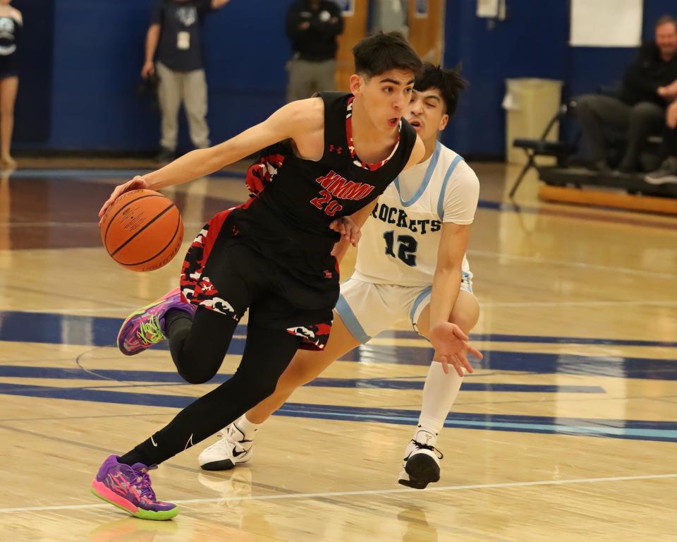 New Mexico Military Institute's Lorenzo Peral (left) drives against Goddard's Isaiah Mestas during a Jan. 30, 2024 basketball game in Roswell. The Artesia Bulldogs face the Rockets in 4-4A action Feb. 9 in Roswell.