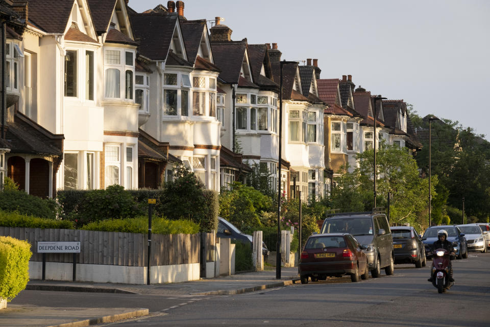 Suburban houses in evening sunshine and a passing moped on the corner of Deepdene and Ferndene Roads in the borough of Lambeth, and on 7th June 2021, in south London, England. (Photo by Richard Baker / In Pictures via Getty Images)