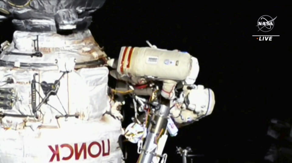 This image provided by NASA, Italian astronaut Samantha Cristoforetti and Russian cosmonaut Oleg Artemyev perform maintenance on the International Space Station on Thursday, July 21, 2022. Cristoforetti teamed up with Artemyev to work on the International Space Station’s newest robot arm. The 37-foot (11-meter) mechanical limb _ contributed by the European Space Agency _ rocketed into orbit with a Russian lab last July. (NASA via AP).