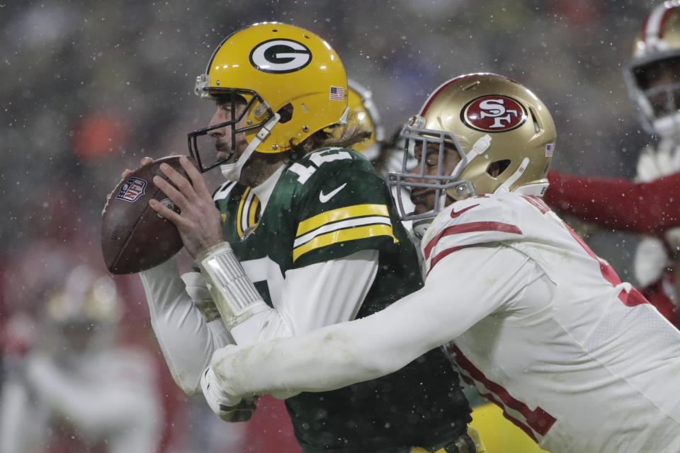 San Francisco 49ers' Arik Armstead sacks Green Bay Packers' Aaron Rodgers during the second half of an NFC divisional playoff NFL football game Saturday, Jan. 22, 2022, in Green Bay, Wis. (AP Photo/Aaron Gash)