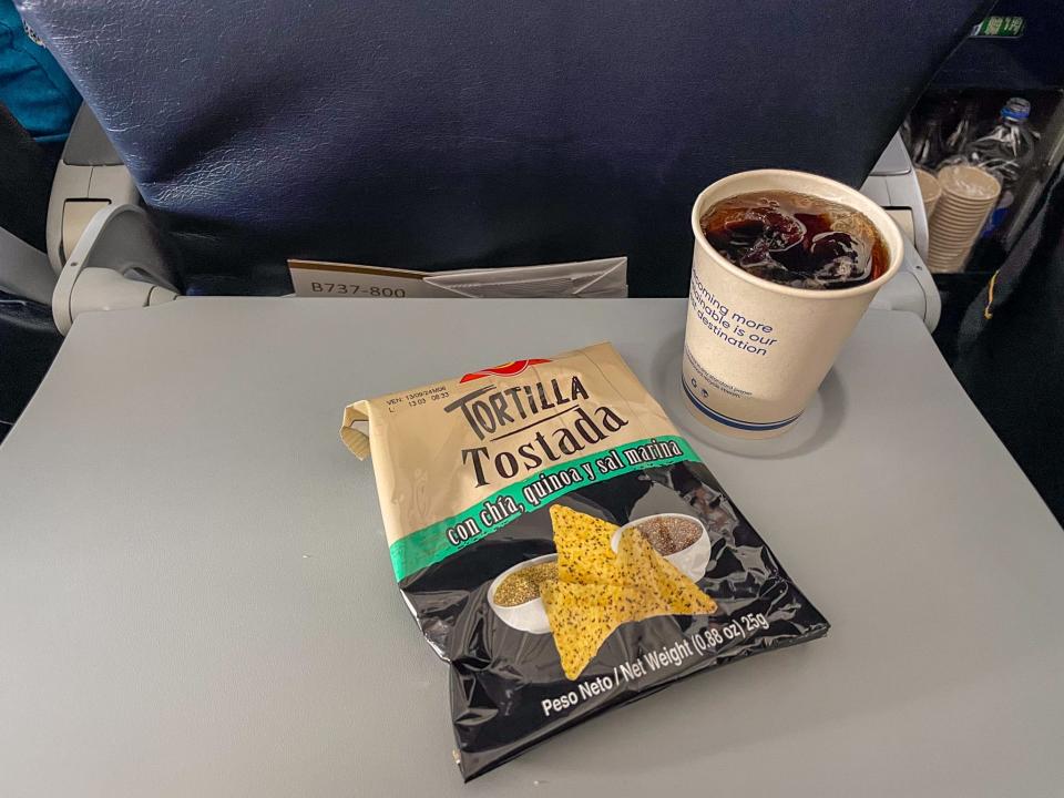 Passengers in economy received tortilla chips and a drink.