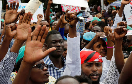 A striking doctor holds a stethoscope and chants slogans along with fellow colleagues outside the Court of Appeal as they wait for the release of jailed officials of the national doctors' union in their case to demand fulfilment of a 2013 agreement between their union and the government that would raise their pay and improve working conditions in Nairobi, Kenya, February 15, 2017. REUTERS/Thomas Mukoya